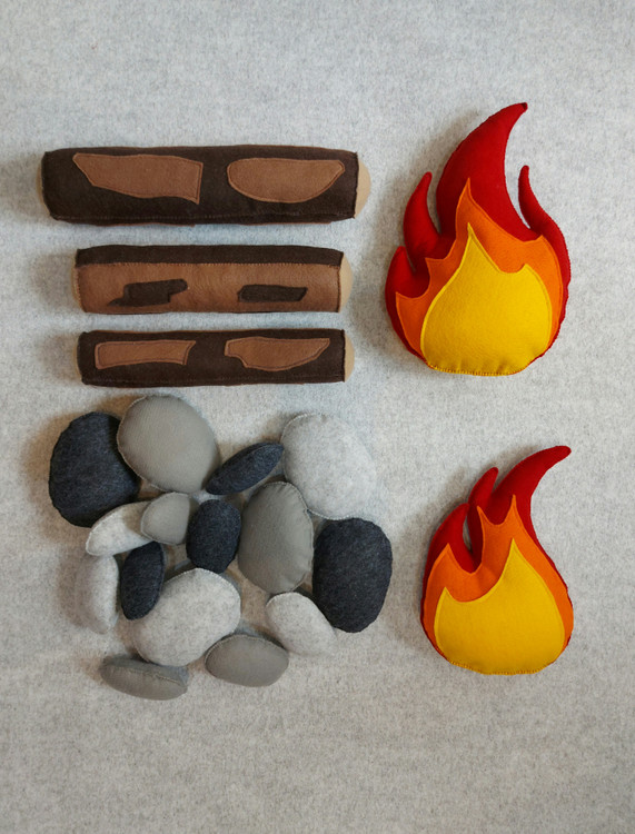 Soft felt fire decor with logs and rocks for playroom